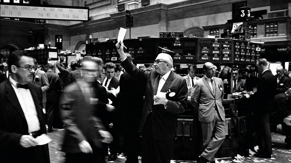Traders at work on the floor of the New York Stock Exchange in 1963